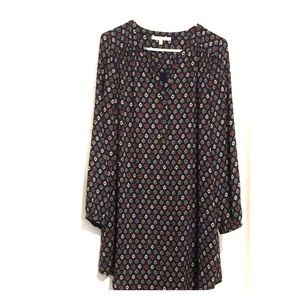 Long sleeve patterned dress.